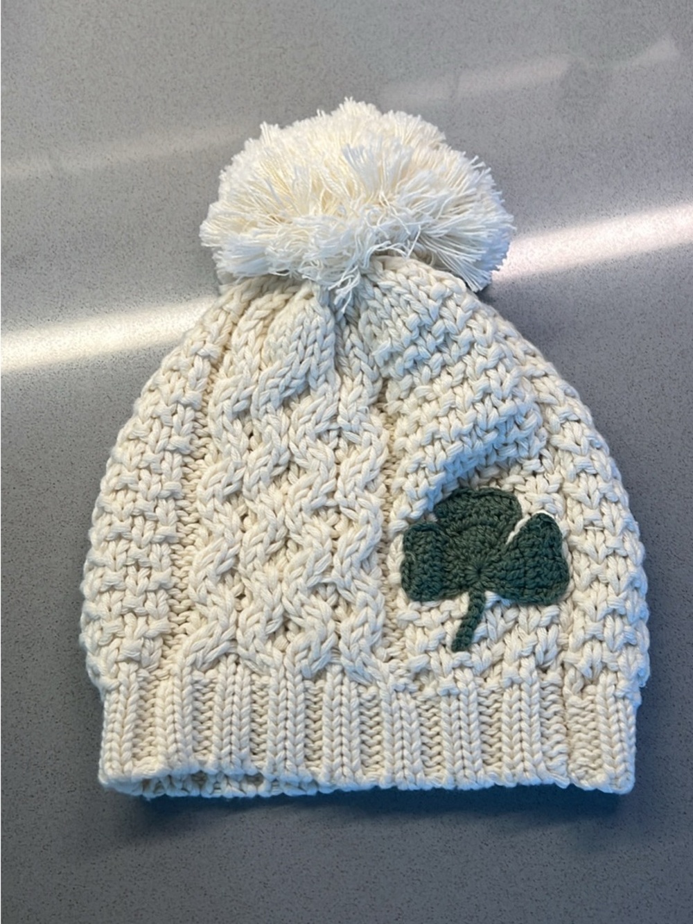 Kids Cream Knit Pom Pom Beanie with Green Clover Accent